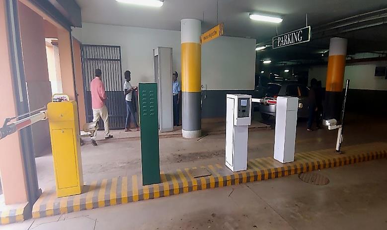 Parking entry and exit barriers with ticket machines at Acacia Mall, Kampala — Picture 15 in the smart-parking study’s final report